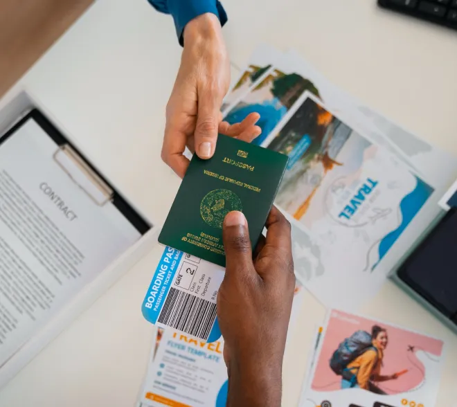 passport and ticket being handed over