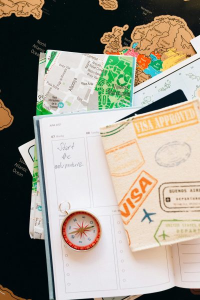 pexels-photo-7235892-7235892 Flat lay of travel essentials including compass, notebook, and map for a journey.